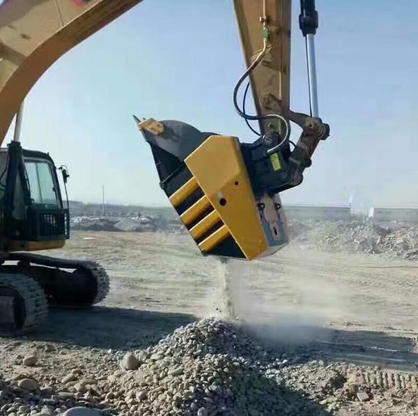 Processing pebbles with excavator crushing bucket